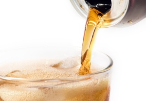 Closeup of a pouring soda on white background